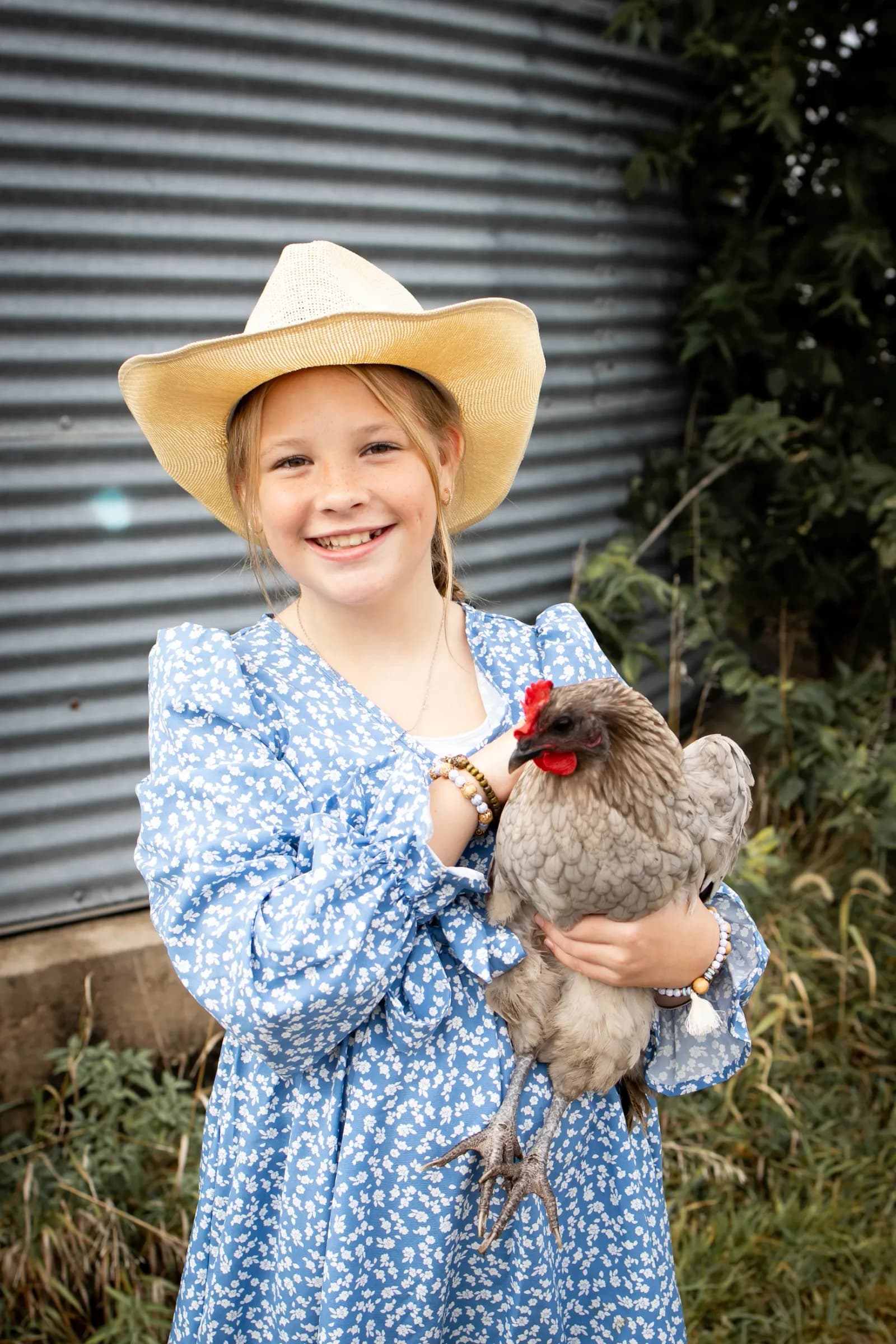 Girl with pet chicken