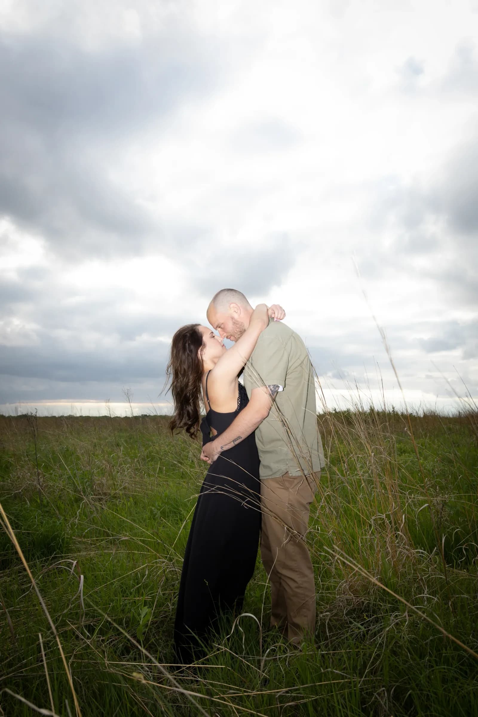 Couple kissing at sunset