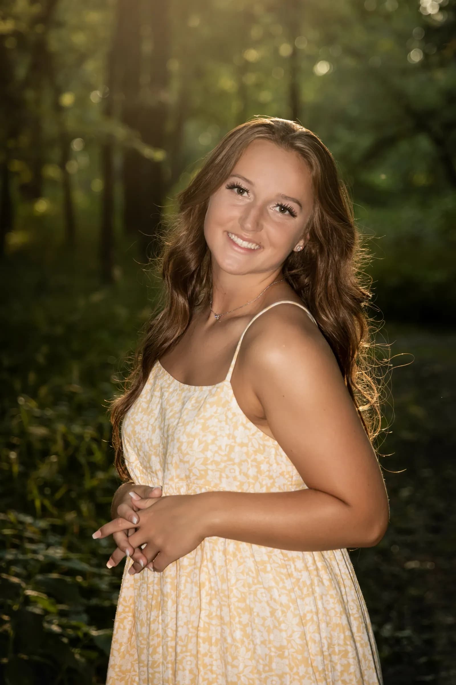 Senior girl in wooded area