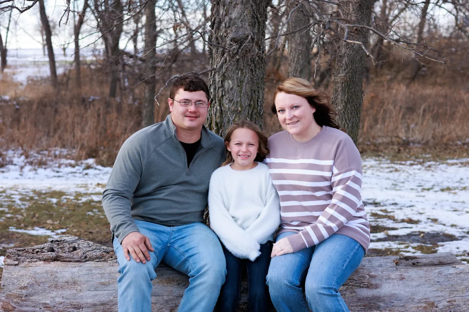 Family of 3 posed in winter