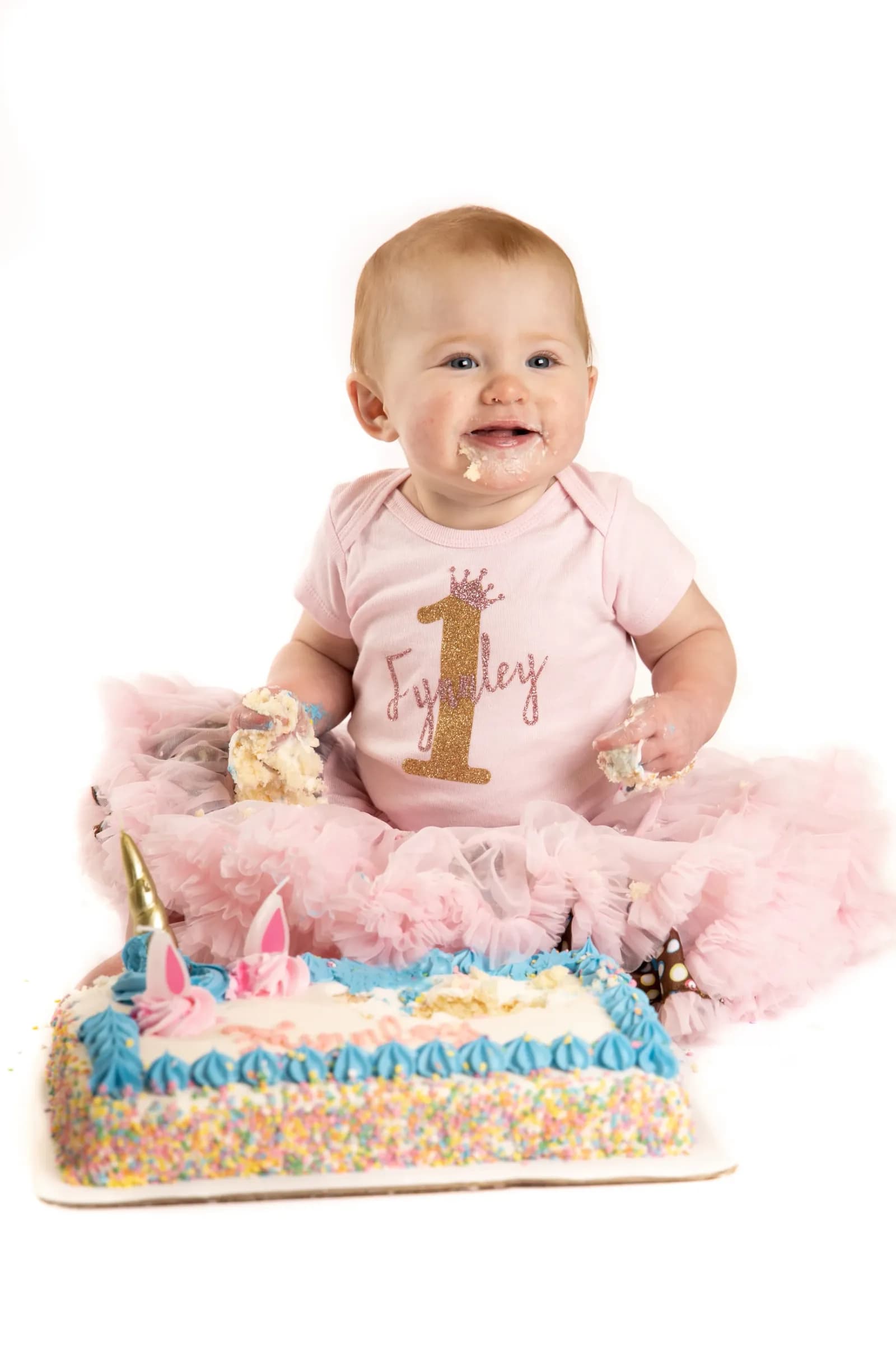 1 year old girl with birthday cake