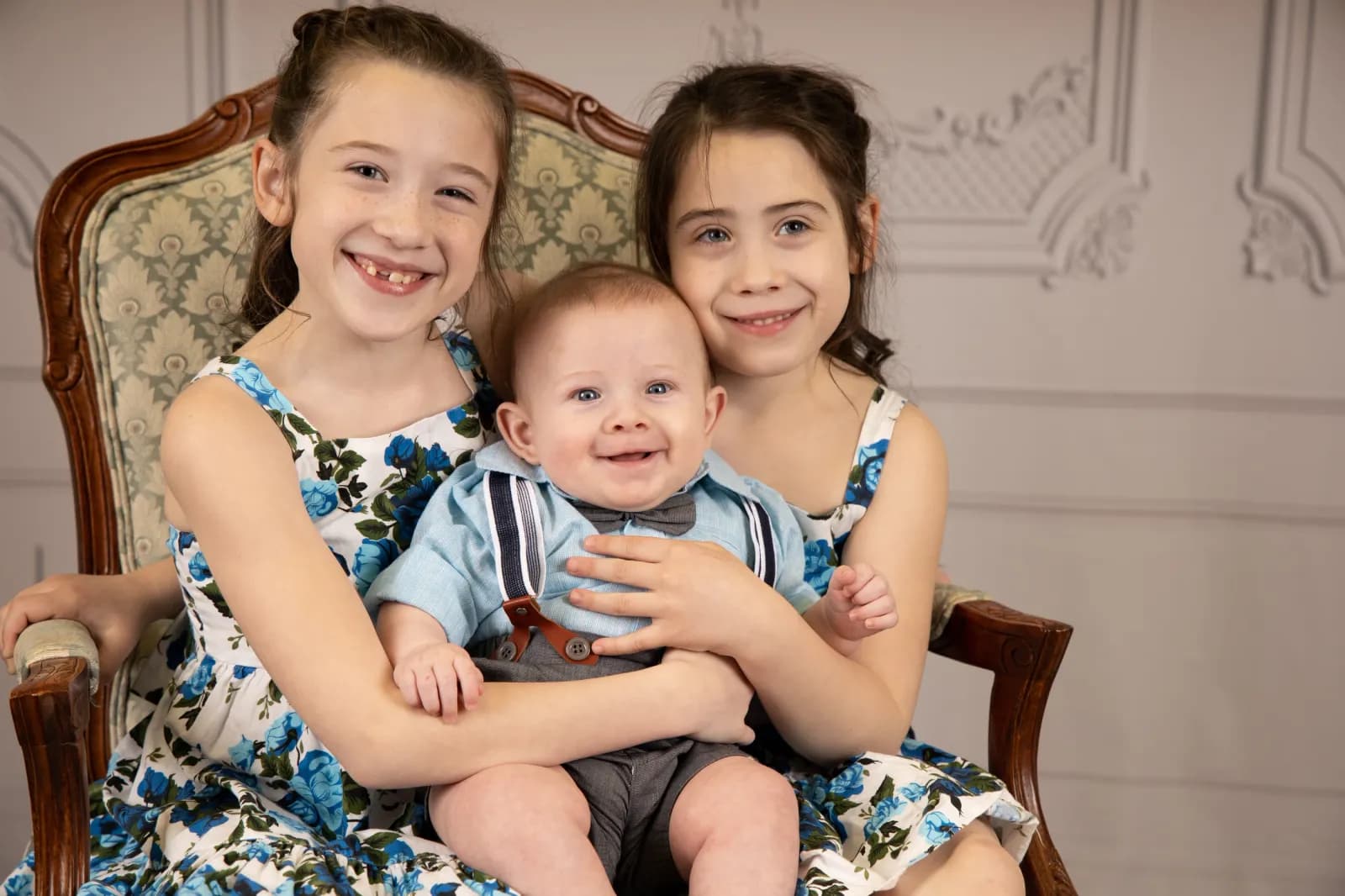 3 children in chair
